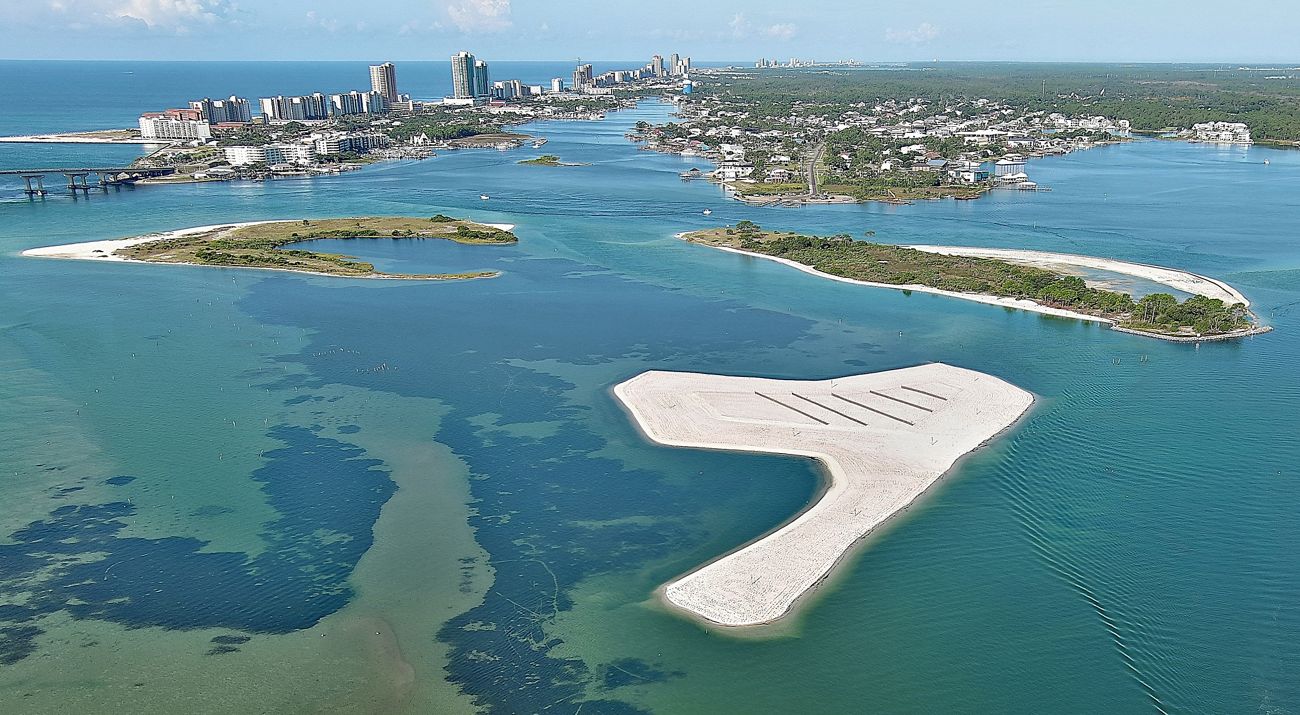 An aerial photograph features a city interspersed with small islands.