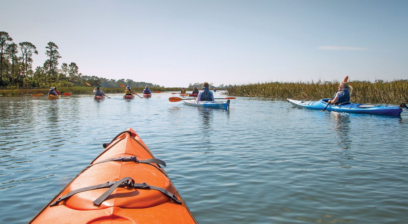 Kayakers paddle along the waterways at Little St. Simons Island.
