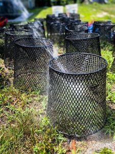 An assortment of fish traps on the ground.