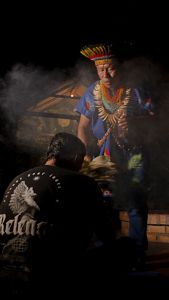 Traditional ceremony in the Amazon, guided by local elder.