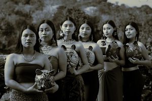 A group of indigenous women with traditional clothes in black and white. 