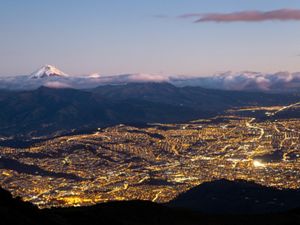 Quito at night with the Chimborazo snow peak in the background