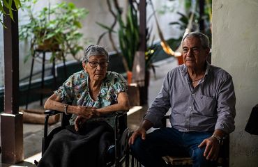 Mother and son post next to one another