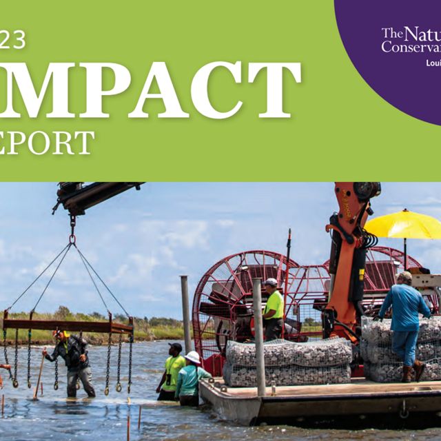 A report cover features people working on a barge.