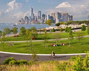 Park-goers enjoy the view at Governors Island in the New York Harbor.
