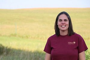 Marissa Ahlering smiling against a prairie backdrop.