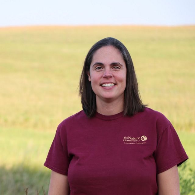 Marissa Ahlering smiling against a prairie backdrop.