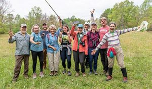 A group of volunteers smiling. 
