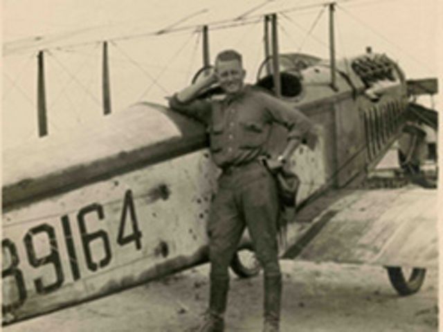 John Joseph Mathews poses in front of a plane during World War I.