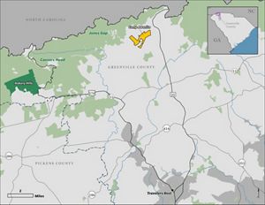 A map features one bright yellow spot surrounded by a landscape depicted in green and gray.