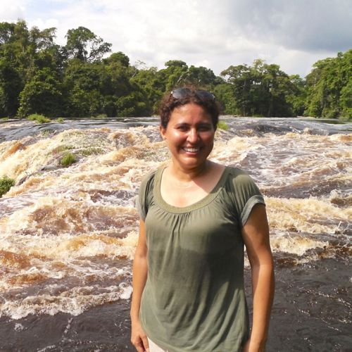 Marie-Claire Paiz standing in front of a rushing river