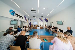 People fill a conference room for a community workshop in Montenegro.