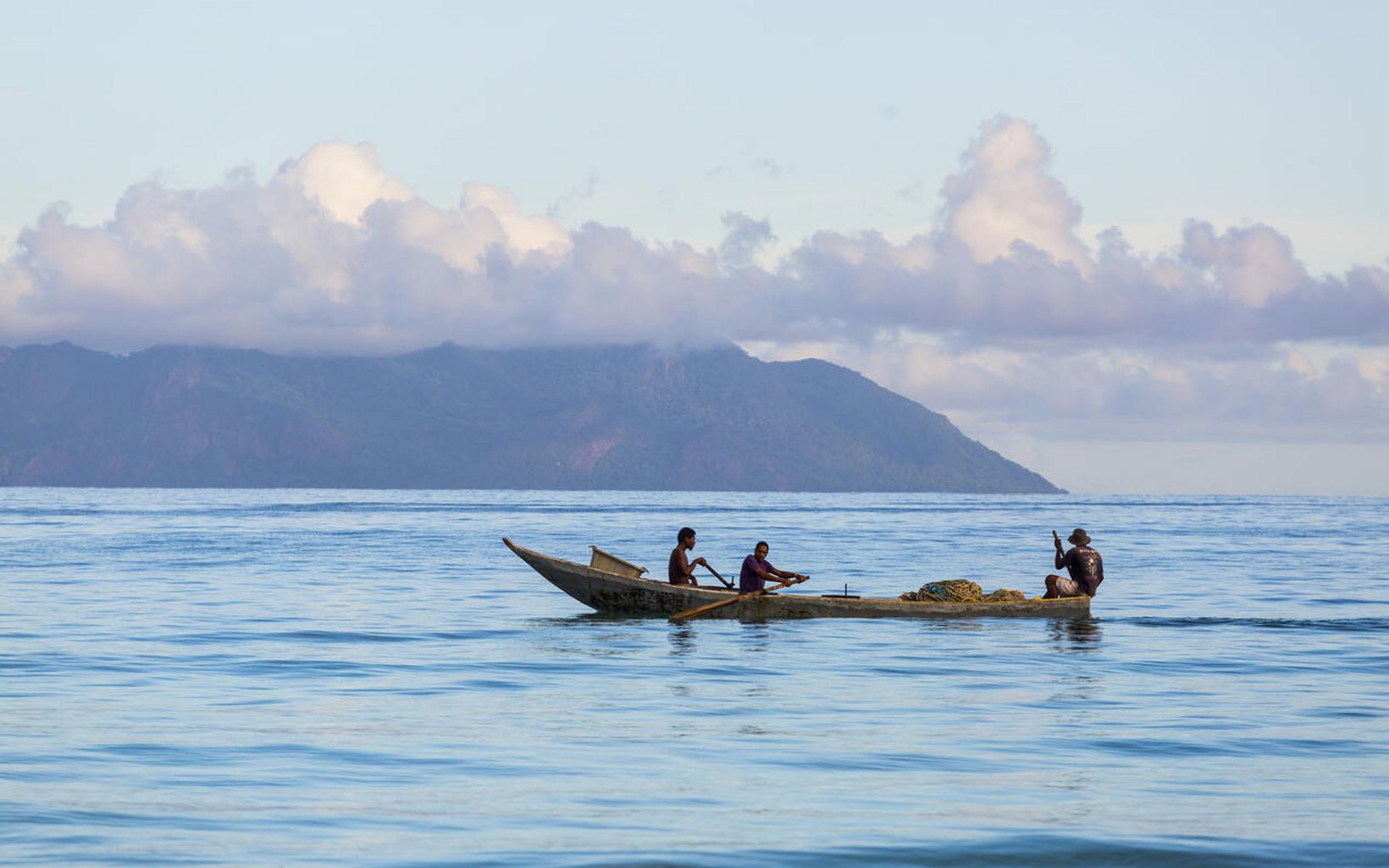 Same boat. Mackrel fishermen catching fish off the shore in Seychelles. © Jason Houston 