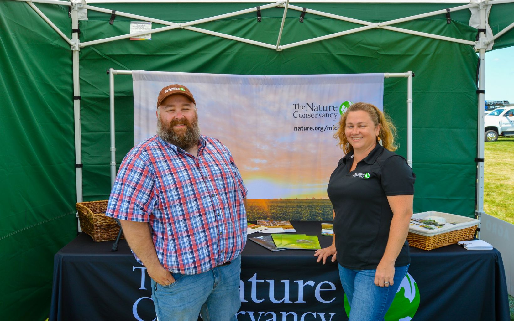 AgroExpo 2022 Joel Leland and Rebecca McNitt were on hand at AgroExpo in Saint Johns, Michigan this summer, where TNC hosted a strip-till equipment booth. © Rebekah Wuchner/TNC