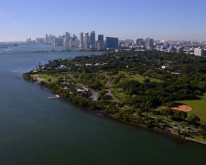 Aerial view of Brittany Bay Park in Miami Beach, which sits along the shoreline with high-rise buildings behind it.