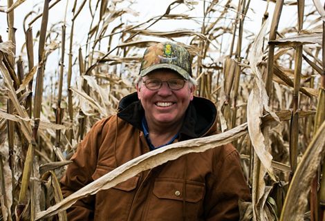 Farmer MIKE WERLING amongst a corn field.
