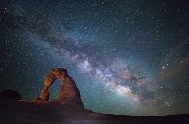 Starry night sky over Arches National Park, showcasing the Milky Way in Moab, Utah.
