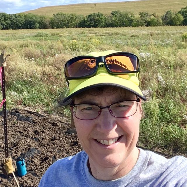 Michele volunteers to coordinate the Prairie Stewards. Here she takes a selfie while working at Tallgrass Prairie National Preserve.