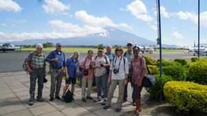 group of people at an open-air airport