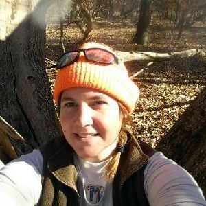 Candid selfie of Molly Anderson taking while hiking.