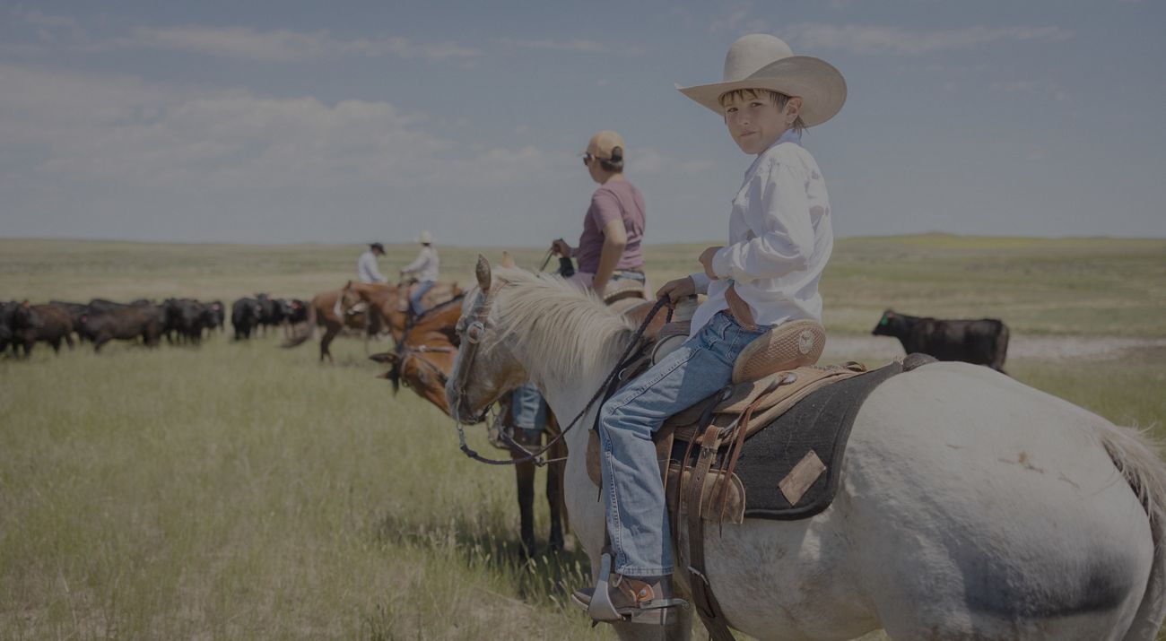 Ranching family on horseback