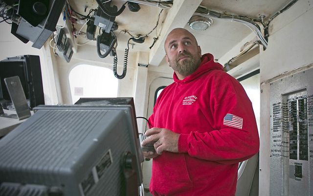 Nick Muto, captain of the Dawn T., uses video equipment to monitor his daily catch from fishing grounds off Cape Cod, Massachusetts.