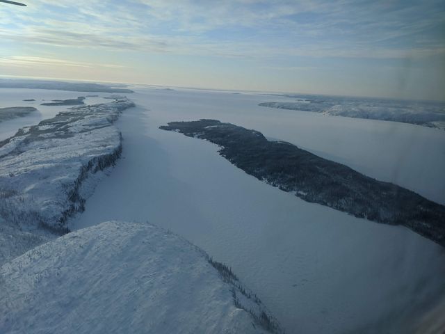 Cliffs, inlets and islands of Thaidene Nëné within Canada's Northwest Territories. In winter, the entire landscape is frozen over.