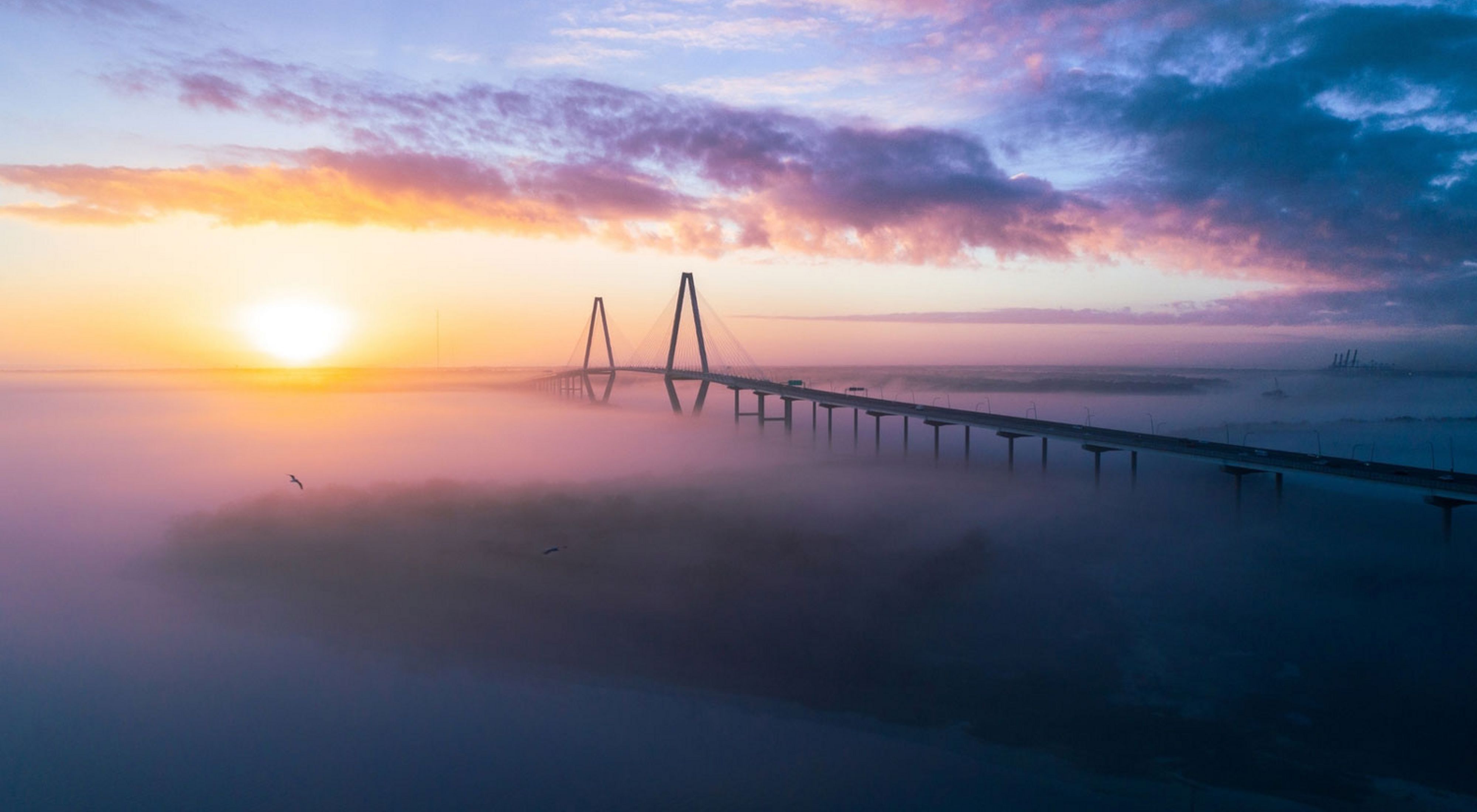Sea fog covered the water below the Ravenel bridge during a chilly sunrise in Charleston, SC in February 2018.