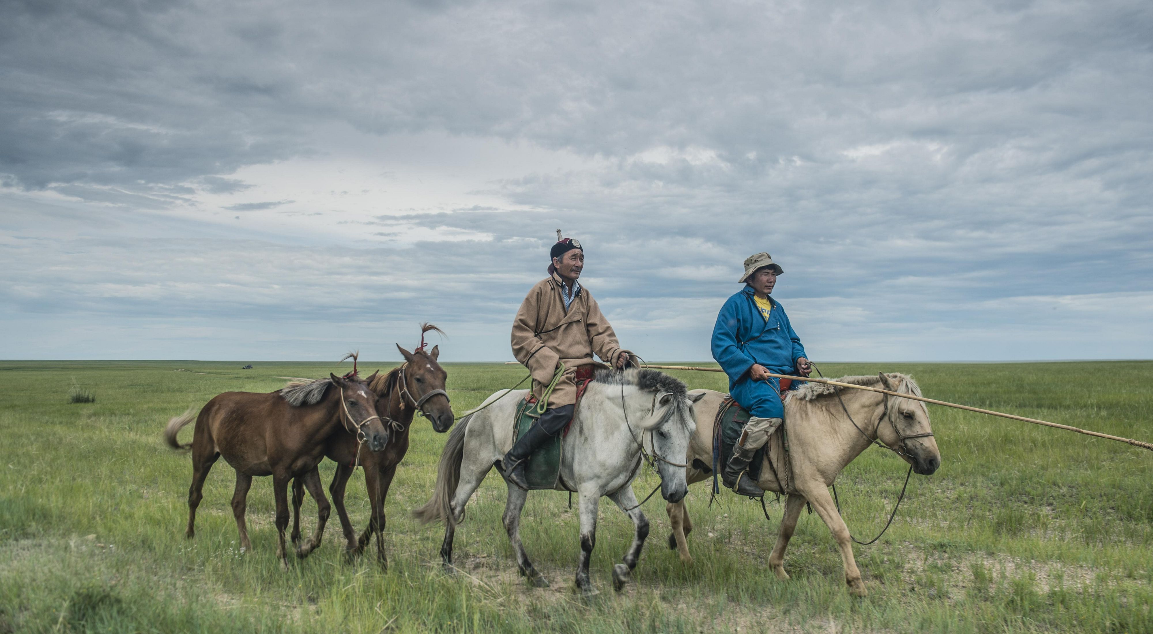 Two herders in Eastern Mongolia's Tosonhulstai Nature Reserve.