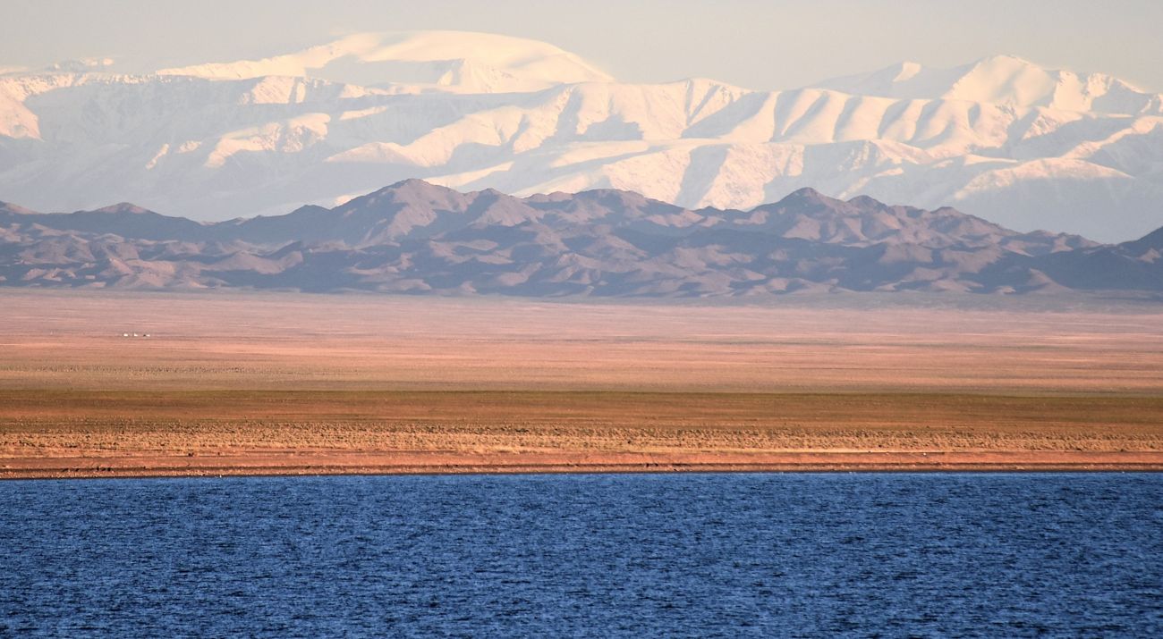 Lake and mountains covered with snow.