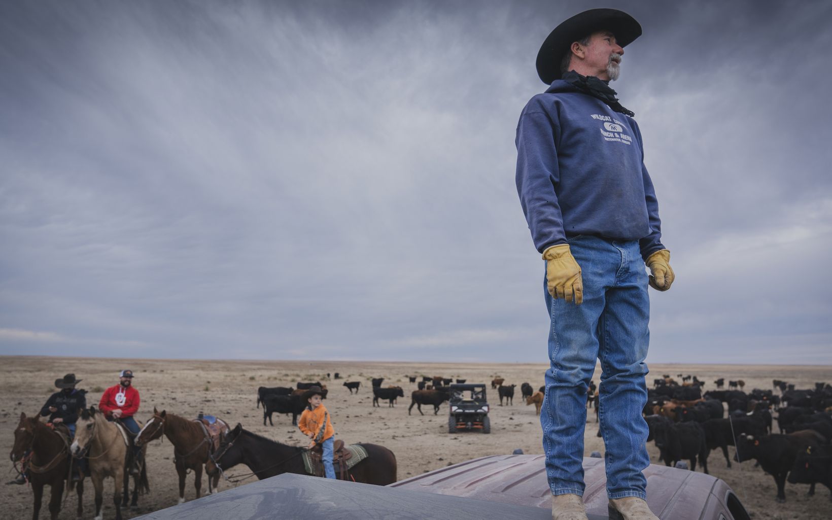 Scanning the Ranch  Treg Hatcher gains a little height in order to see farther across the prairie.  © Morgan Heim 
