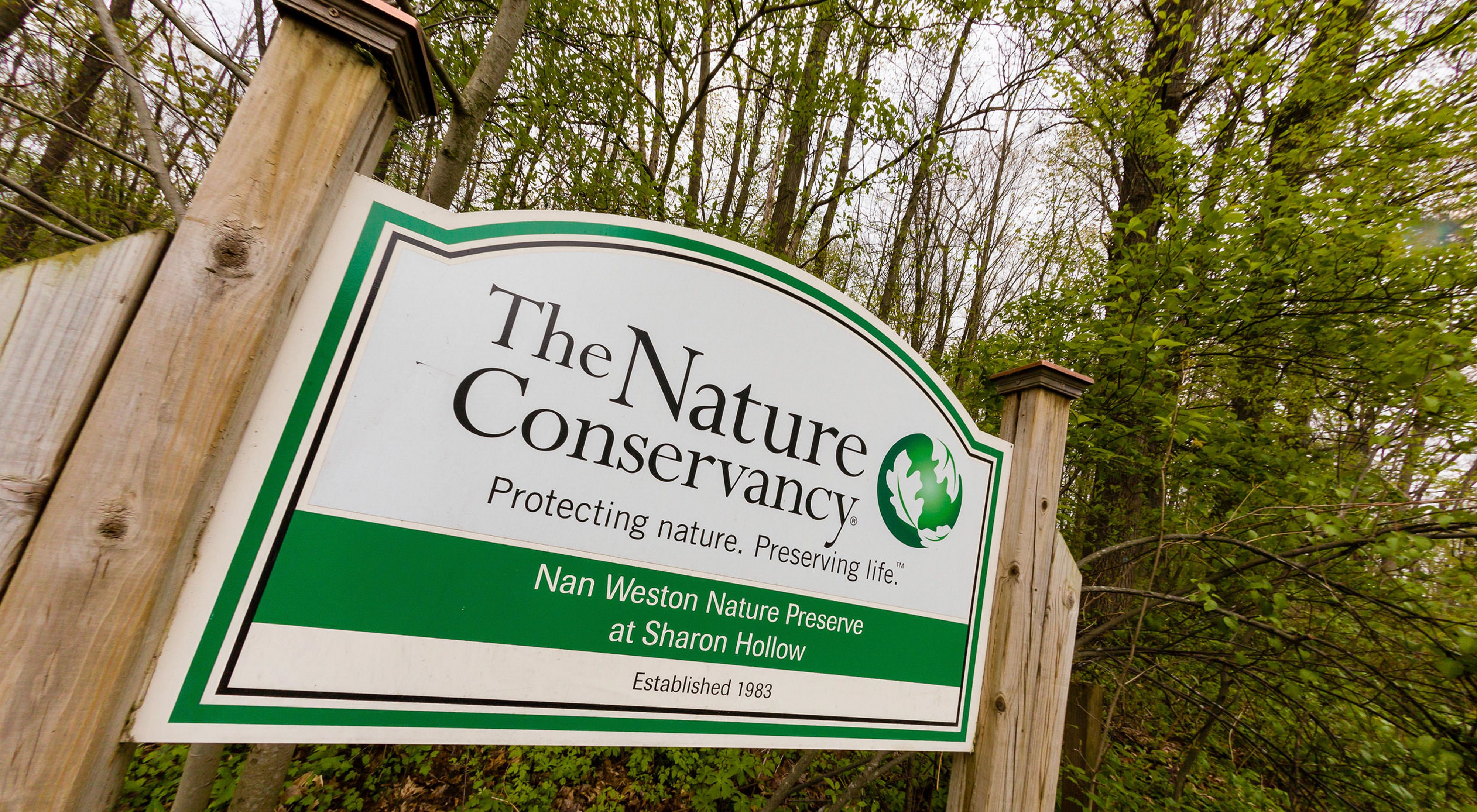 Preserve kiosk sign for The Nature Conservancy's Nan Weston Nature Preserve at Sharon Hollow.