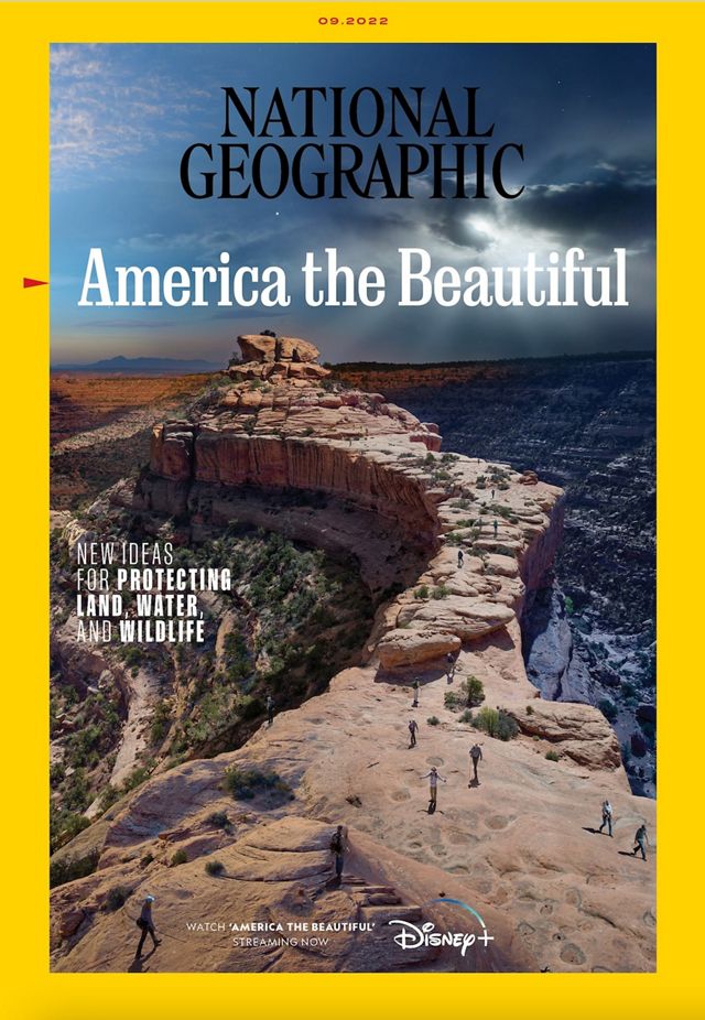 National Geographic magazine cover. The masthead and title, America the Beautiful, are superimposed over a dramatic southwest landscape inside a narrow yellow border.