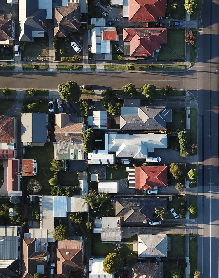top down shot of housing development with trees