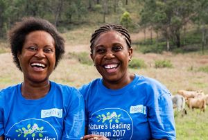 Two women smiling.