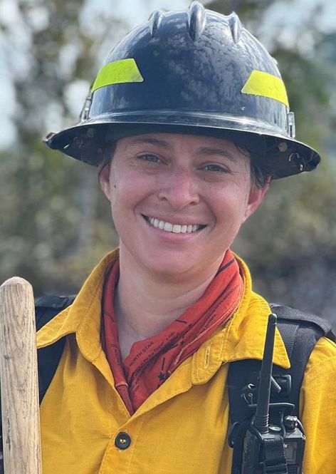 A headshot of Natasha Whetzel in fire gear.