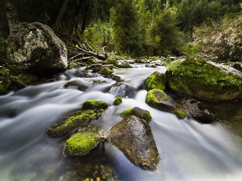 a long exposure image of a flowing river.