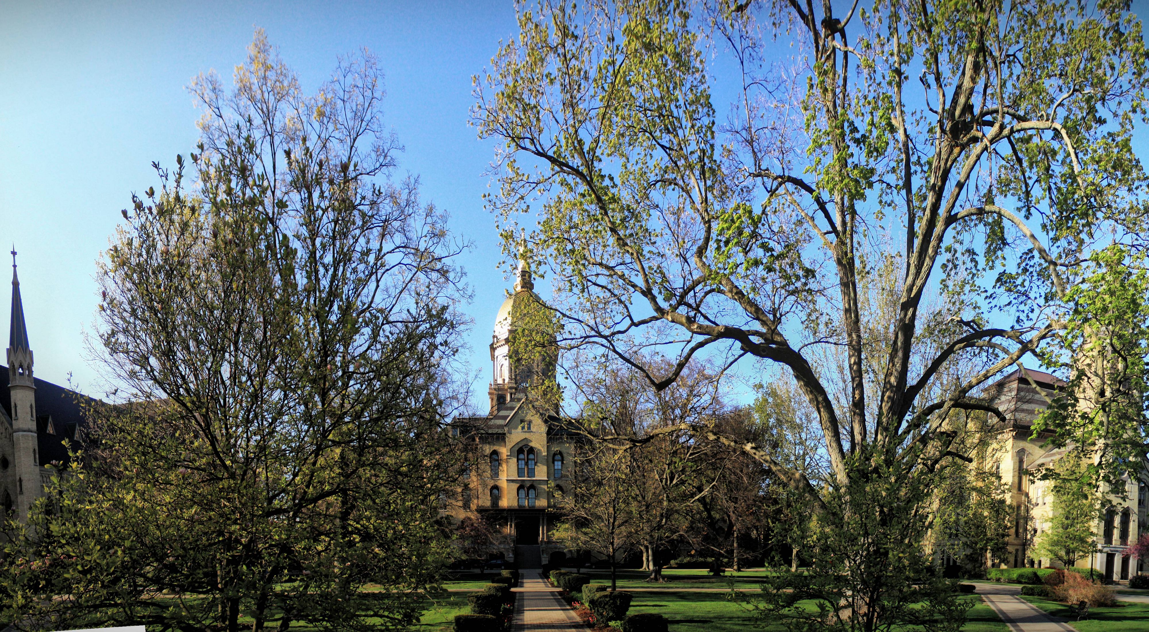 Buildings on University of Notre Dame campus in springtime.