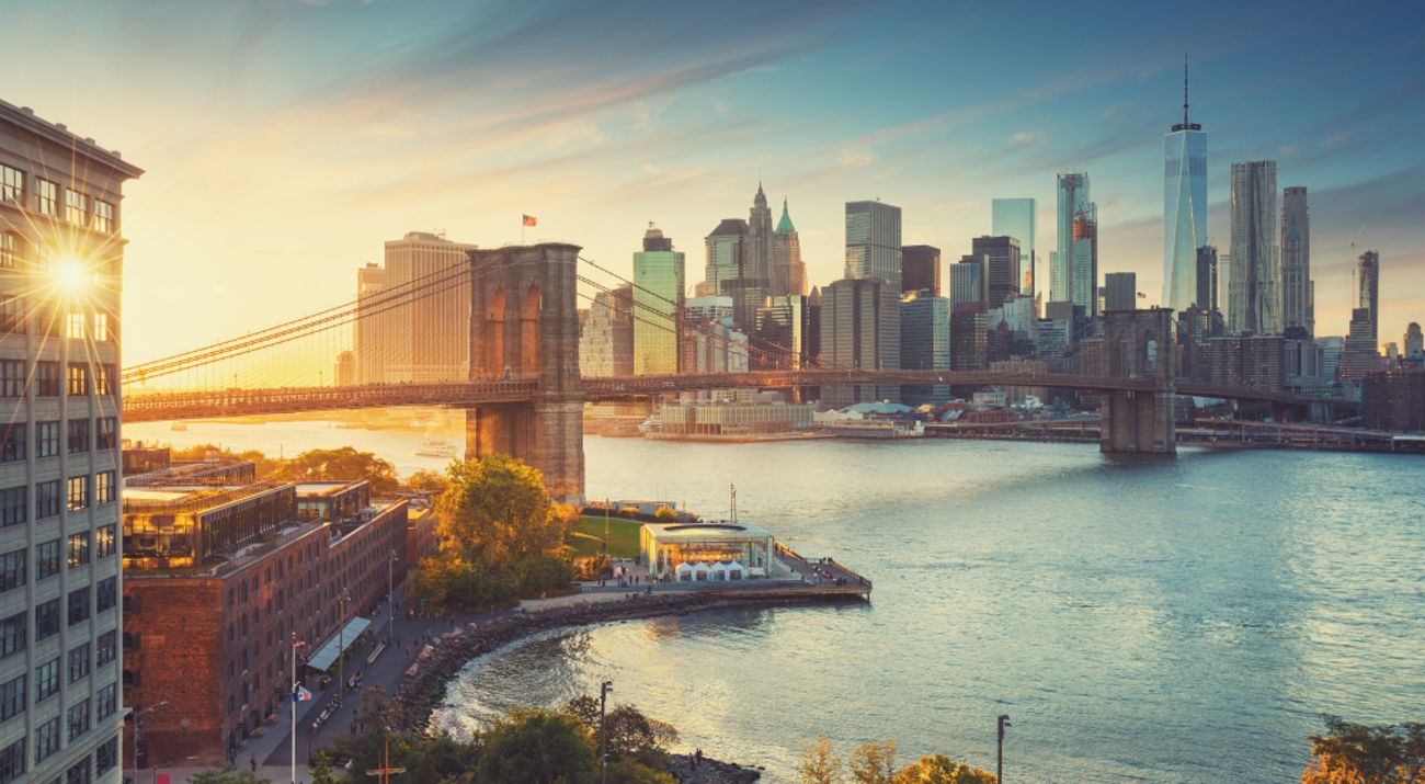 A view of the New York City skyline including the Brooklyn Bridge.