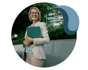 A Canadian policy leader holds documents.