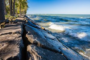A breakwall of rocks lining Lake Erie.