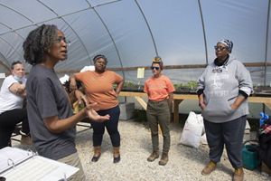 Agraria Center Regenerative Farming Fellows in hoop house.