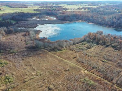 Aerial view of Baker Swamp mitigation project site surrounded by early forest and farms.