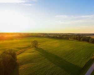 Aerial view of sunrise at farm.