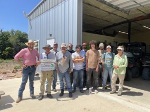 Group of volunteers posing for photo.