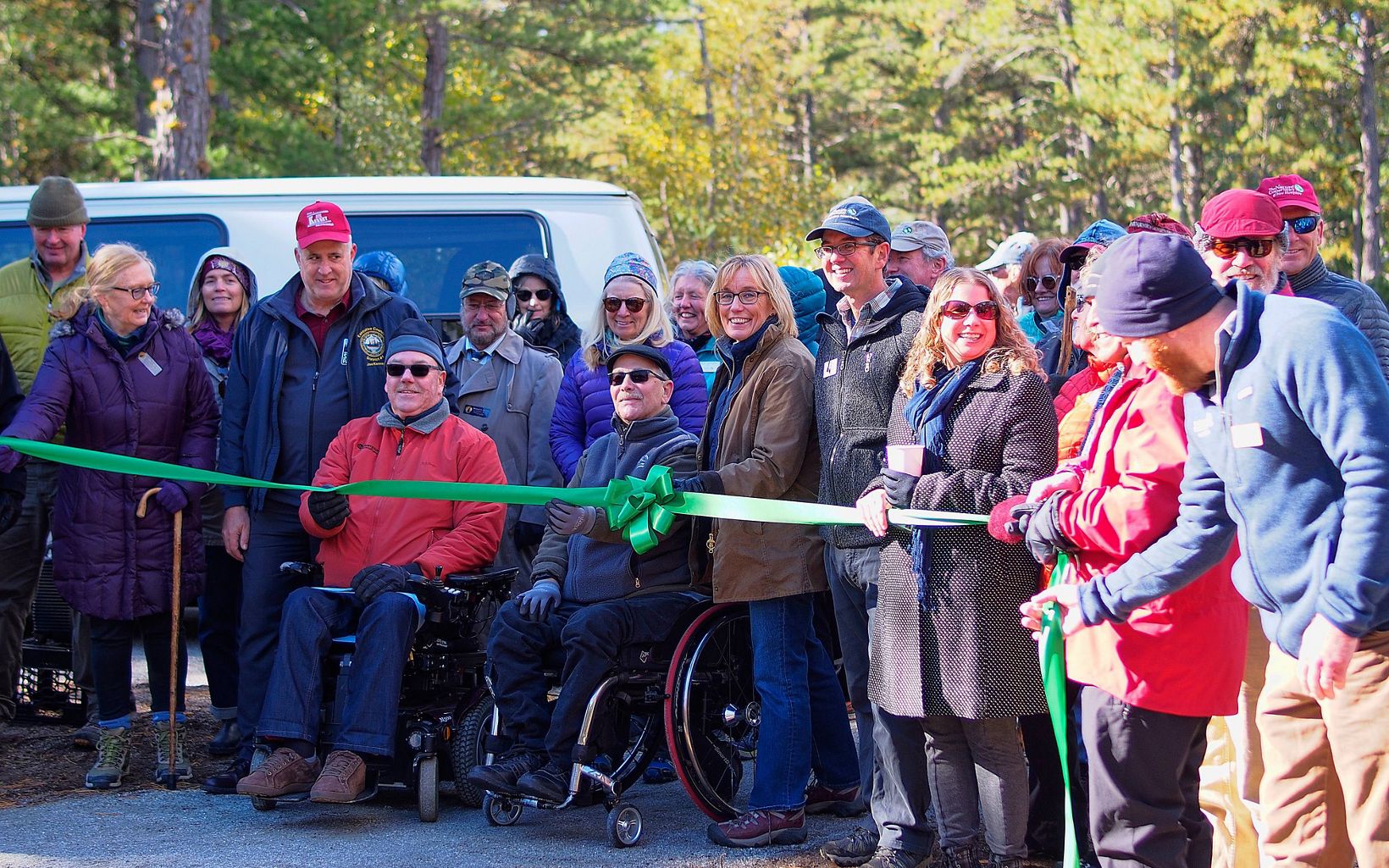 Ribbon Cutting U.S. Senator Maggie Hassan and former NH State Director Mark Zankel help in cutting the ribbon to open a new accessible trail at the Ossipee Pine Barrens Preserve. © Charles DeCurtis/TNC                                                               