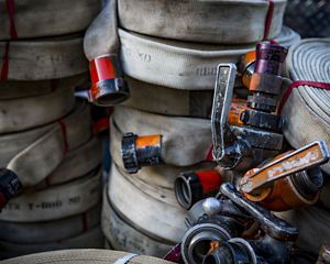 Photo of wildland fire gear, hoses and couplings.