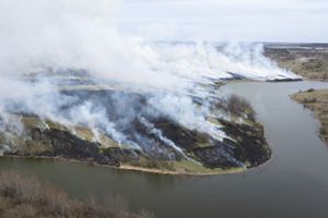 Aerial image of smoke and a river.