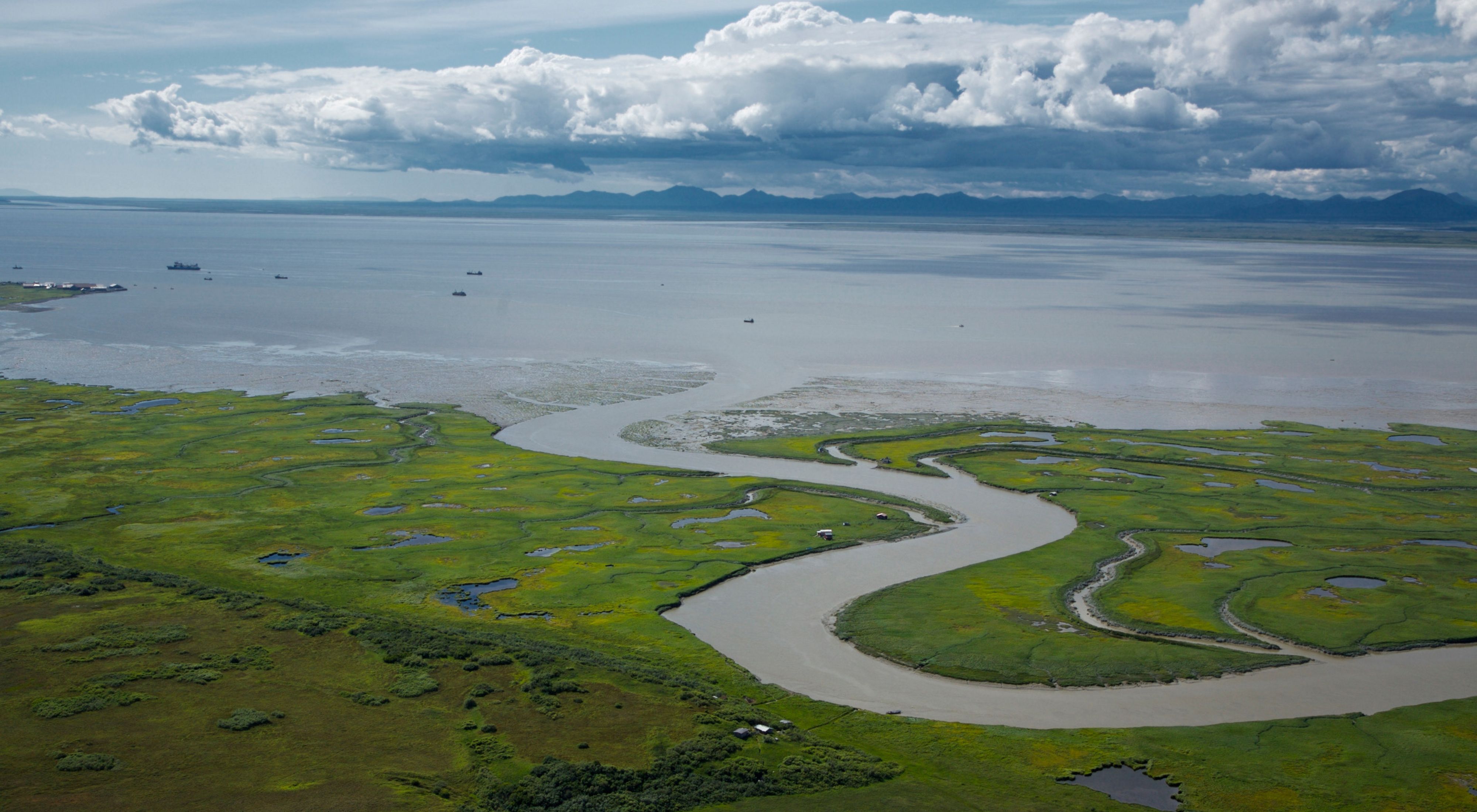 Aerial view of the Alaskan landscape of Bristol Bay and mountains.