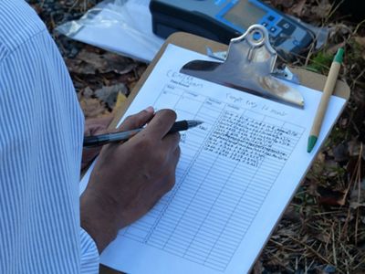 NatureNet Fellow logs data from water samples.